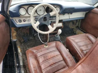 1977 Porsche 911 with VIN 9117212463, listed as a Copart auction lot 46277515 with Not provided miles and Clean title. Bid and sale history available at DreamBid. Image 8.