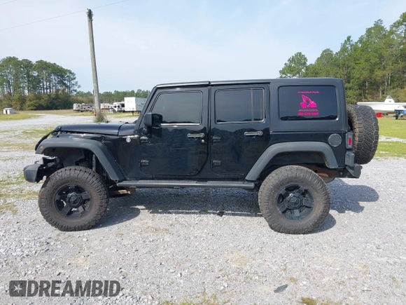 2012 Jeep Wrangler Unlimited Sport with VIN 1C4BJWDG2CL258264, listed as a IAAI auction lot 41880235 with 173,661 mi miles. Bid and sale history available at carsss.com. Image 15.