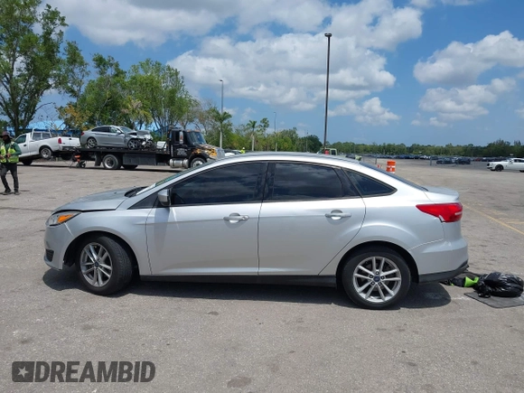2018 Ford Focus SE z VIN 1FADP3FE9JL241661, wystawiony jako IAAI lot #42103513 z przebiegiem 117 003 mil mil oraz . Historia ofert i sprzedaży dostępna na DreamBid. Obrazek 14.
