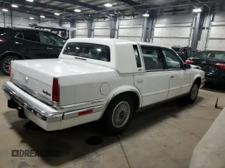 1991 Chrysler New Yorker z VIN 1C3XY66R1MD290977, wystawiony jako Copart lot #83359124 z przebiegiem 98 611 mil mil oraz Szkody całkowita. Historia ofert i sprzedaży dostępna na DreamBid. Obrazek 3.