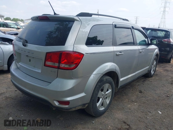 2012 Dodge Journey SXT with VIN 3C4PDDBG1CT323727, listed as a IAAI auction lot 42473238 with 77,035 mi miles and . Bid and sale history available at DreamBid. Image 4.