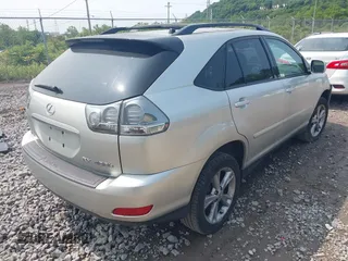 2006 Lexus RX 400h with VIN JTJHW31U460032959, listed as a IAAI auction lot 42382651 with 136,961 mi miles and . Bid and sale history available at DreamBid. Image 4.