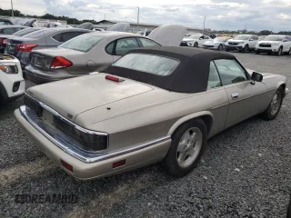 1995 Jaguar XJS with VIN SAJNX2747SC196723, listed as a Copart auction lot 74147364 with 70,138 mi miles and Salvage Title. Bid and sale history available at carsss.com. Image 3.