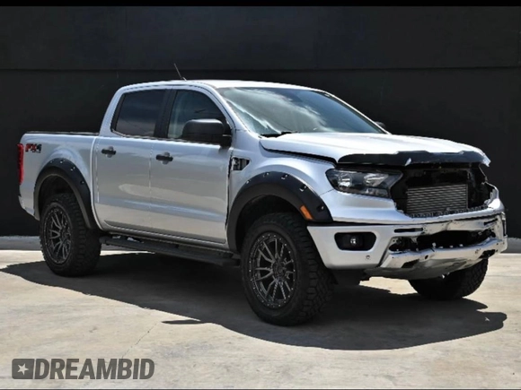 2019 Ford Ranger XL with VIN 1FTER4FH5KLA29401, listed as a Copart auction lot 64990365 with 98,143 mi miles and Salvage title. Bid and sale history available at DreamBid. Image 1.