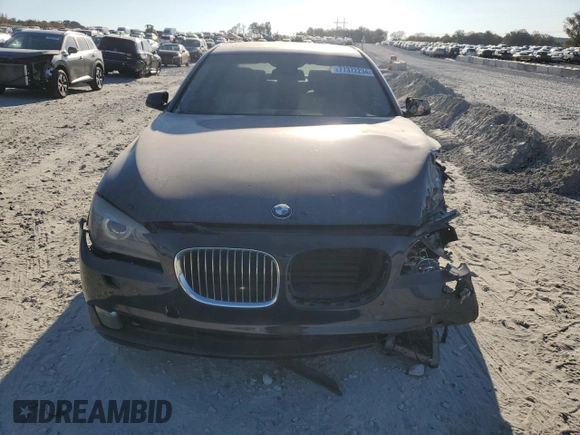 2011 BMW 7 Series 740i with VIN WBAKA4C51BC612629, listed as a Copart auction lot 77372234 with 164,471 mi miles and Salvage Title. Bid and sale history available at carsss.com. Image 5.