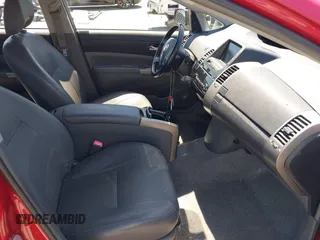 2007 Toyota Prius z VIN JTDKB20U373288946, wystawiony jako IAAI lot #42385536 z przebiegiem 133 336 mil mil oraz . Historia ofert i sprzedaży dostępna na DreamBid. Obrazek 5.