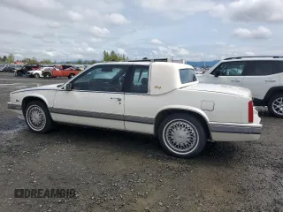 1991 Cadillac Eldorado z VIN 1G6EL13B9MU604115, wystawiony jako Copart lot #52232425 z przebiegiem 95 570 mil mil oraz Szkody całkowita. Historia ofert i sprzedaży dostępna na DreamBid. Obrazek 2.