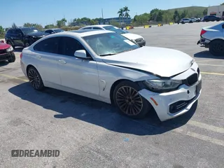 2015 BMW 4 Series 428i with VIN WBA4A5C58FGK15335, listed as a IAAI auction lot 41723243 with 152,652 mi miles and . Bid and sale history available at carsss.com. Image 1.