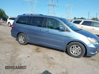 2006 Honda Odyssey Touring z VIN 5FNRL38866B101371, wystawiony jako IAAI lot #42408495 z przebiegiem 152 510 mil mil oraz . Historia ofert i sprzedaży dostępna na DreamBid. Obrazek 1.