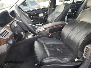 2006 BMW 7 Series 750i with VIN WBAHL83506DT05674, listed as a Copart auction lot 77176834 with 263,495 mi miles and Salvage title. Bid and sale history available at DreamBid. Image 7.