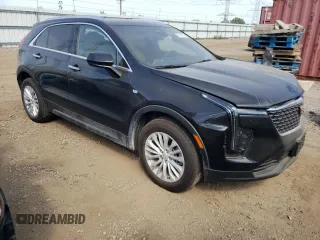 2024 Cadillac XT4 AWD Luxury with VIN 1GYFZBR4XRF199970, listed as a Copart auction lot 71496774 with 4,512 mi miles and Salvage Title. Bid and sale history available at carsss.com. Image 4.