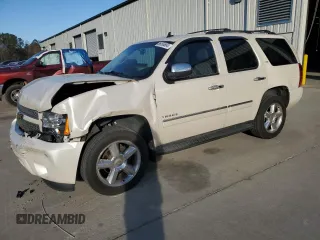 2013 Chevrolet Tahoe LTZ с VIN 1GNSCCE09DR317231, выставлен на аукционе Copart как лот 86056684 с пробегом 116 151 миль миль и Списание • Salvage title. История ставок и продаж доступна на DreamBid. Изображение 1.