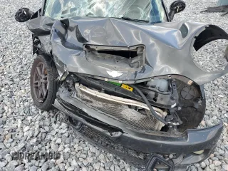 2011 MINI Hardtop S with VIN WMWSV3C55BTY20530, listed as a Copart auction lot 56016985 with Not Provided miles and Salvage Title. Bid and sale history available at DreamBid. Image 11.