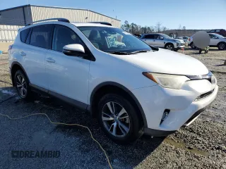 2018 Toyota RAV4 XLE with VIN 2T3WFREV2JW454202, listed as a Copart auction lot 41599855 with 144,442 mi miles and Salvage title. Bid and sale history available at DreamBid. Image 4.