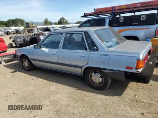 1986 Toyota Camry z VIN JT2SV12E3G6021210, wystawiony jako Copart lot #49623985 z przebiegiem 144 064 mil mil oraz Czysty tytuł • Clean title. Historia ofert i sprzedaży dostępna na DreamBid. Obrazek 2.