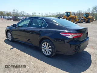 2020 Toyota Camry LE with VIN 4T1C11AK9LU387012, listed as a IAAI auction lot 42103647 with 64,049 mi miles and . Bid and sale history available at carsss.com. Image 3.