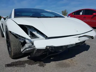 2009 Lamborghini Gallardo z VIN ZHWGU54T59LA07777, wystawiony jako IAAI lot #39749159 z przebiegiem 8730 mil mil oraz . Historia ofert i sprzedaży dostępna na DreamBid. Obrazek 20.