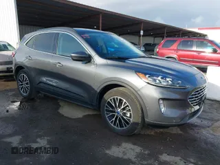 2022 Ford Escape Titanium Plug-In Hybrid z VIN 1FMCU0LZ9NUA91244, wystawiony jako IAAI lot #41891631 z przebiegiem 30 180 mil mil oraz . Historia ofert i sprzedaży dostępna na DreamBid. Obrazek 1.