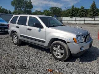 2005 Jeep Grand Cherokee Laredo with VIN 1J4GR48KX5C565762, listed as a Copart auction lot 63080115 with 122,349 mi miles and Salvage title. Bid and sale history available at DreamBid. Image 4.
