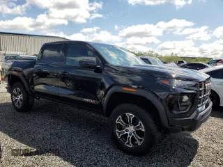 2023 GMC Canyon 4WD AT4 with VIN 1GTP6DEK9P1151776, listed as a Copart auction lot 52977805 with 11,750 mi miles and Salvage Title. Bid and sale history available at carsss.com. Image 4.