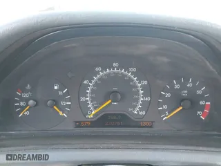 1999 Mercedes-Benz CLK-Class with VIN WDBLK65G6XT006151, listed as a IAAI auction lot 41597025 with 230,751 mi miles. Bid and sale history available at carsss.com. Image 7.