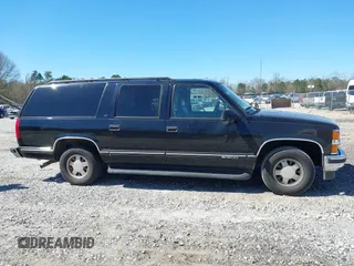 1999 Chevrolet Suburban with VIN 3GNEC16R0XG137834, listed as a IAAI auction lot 41853492 with 296,147 mi miles. Bid and sale history available at carsss.com. Image 13.