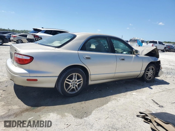 2000 Mazda Millenia with VIN JM1TA2210Y1614967, listed as a Copart auction lot 53606185 with 120,288 mi miles and Salvage Title. Bid and sale history available at DreamBid. Image 3.