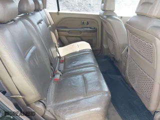 2004 Honda Pilot EX with VIN 2HKYF18524H546430, listed as a IAAI auction lot 42060241 with 126,931 mi miles. Bid and sale history available at carsss.com. Image 8.