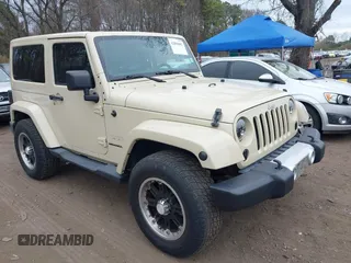 2012 Jeep Wrangler Arctic z VIN 1C4AJWBG1CL103607, wystawiony jako IAAI lot #42004802 z przebiegiem 72 030 mil mil oraz . Historia ofert i sprzedaży dostępna na DreamBid. Obrazek 1.