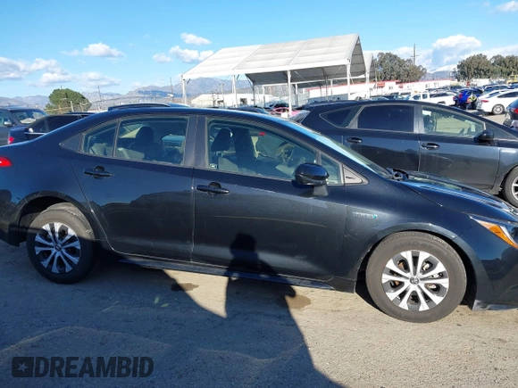 2021 Toyota Corolla Hybrid LE with VIN JTDEAMDE5MJ014959, listed as a IAAI auction lot 41751203 with 26,220 mi miles. Bid and sale history available at carsss.com. Image 13.