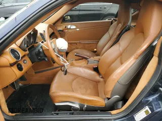 2006 Porsche Cayman S с VIN WP0AB298X6U781940, выставлен на аукционе Copart как лот 70092204 с пробегом 116 506 миль миль и Списание • Salvage title. История ставок и продаж доступна на DreamBid. Изображение 7.