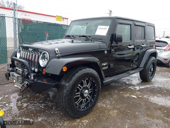 2011 Jeep Wrangler Unlimited Sahara with VIN 1J4BA5H12BL548870, listed as a IAAI auction lot 42010303 with 139,693 mi miles. Bid and sale history available at carsss.com. Image 17.