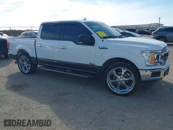 2018 Ford F-150 XL with VIN 1FTEW1C59JKD98218, listed as a IAAI auction lot 41406012 with 103,435 mi miles. Bid and sale history available at carsss.com. Image 1.