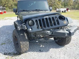 2012 Jeep Wrangler Unlimited Sport with VIN 1C4BJWDG2CL258264, listed as a IAAI auction lot 41880235 with 173,661 mi miles. Bid and sale history available at carsss.com. Image 6.