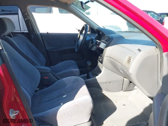 1999 Mazda Protege ES with VIN JM1BJ2210X0150191, listed as a IAAI auction lot 41577974 with 121,138 mi miles. Bid and sale history available at carsss.com. Image 5.