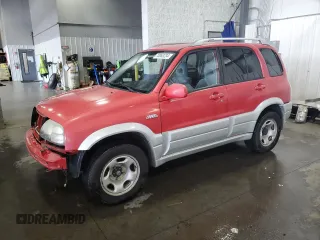 2004 Suzuki Grand Vitara LX z VIN JS3TD62V444101460, wystawiony jako Copart lot #70063234 z przebiegiem 113 618 mil mil oraz Szkoda całkowita • Salvage title. Historia ofert i sprzedaży dostępna na DreamBid. Obrazek 1.