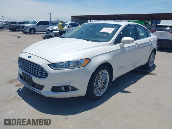 2014 Ford Fusion SE Hybrid with VIN 3FA6P0LUXER233658, listed as a IAAI auction lot 42311588 with 106,282 mi miles and . Bid and sale history available at DreamBid. Image 2.
