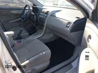 2011 Toyota Corolla L with VIN 2T1BU4EE7BC672168, listed as a IAAI auction lot 41735610 with 168,274 mi miles. Bid and sale history available at carsss.com. Image 5.