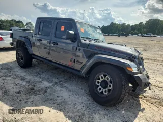 2021 Jeep Gladiator 80th Anniversary с VIN 1C6HJTAG7ML521094, выставлен на аукционе Copart как лот 61276595 с пробегом 68 684 миль миль и Списание • Salvage title. История ставок и продаж доступна на DreamBid. Изображение 4.