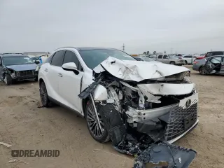 2023 Lexus RX with VIN 2T2BAMBAXPC002806, listed as a Copart auction lot 42963575 with 27,315 mi miles and Salvage Title. Bid and sale history available at carsss.com. Image 4.