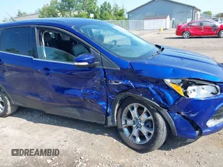2013 Ford Escape SEL z VIN 1FMCU9H92DUA24951, wystawiony jako IAAI lot #42408755 z przebiegiem 173 549 mil mil oraz . Historia ofert i sprzedaży dostępna na DreamBid. Obrazek 6.