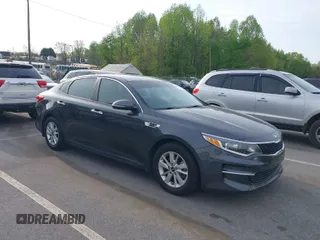 2016 Kia Optima LX with VIN KNAGT4L33G5107444, listed as a IAAI auction lot 41971006 with 174,997 mi miles. Bid and sale history available at carsss.com. Image 1.