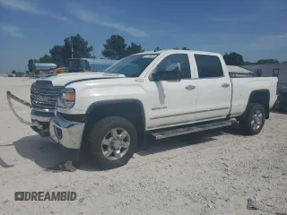 2018 GMC Sierra 2500HD SLT with VIN 1GT12TEYXJF197515, listed as a Copart auction lot 57989345 with 87,634 mi miles and Salvage title. Bid and sale history available at DreamBid. Image 1.