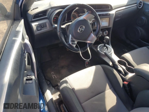 2016 Scion tC z VIN JTKJF5C75GJ022534, wystawiony jako Copart lot #52254005 z przebiegiem 103 812 mil mil oraz Szkoda całkowita • Salvage title. Historia ofert i sprzedaży dostępna na DreamBid. Obrazek 8.