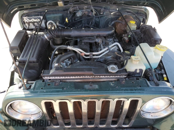 2000 Jeep Wrangler Sahara z VIN 1J4FA59S1YP746043, wystawiony jako Copart lot #58842665 z przebiegiem 148 348 mil mil oraz Szkoda całkowita • Salvage title. Historia ofert i sprzedaży dostępna na DreamBid. Obrazek 11.