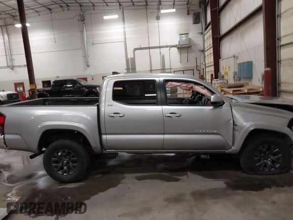 2023 Toyota Tacoma SR with VIN 3TMCZ5AN9PM604793, listed as a IAAI auction lot 42251347 with 39,741 mi miles and . Bid and sale history available at DreamBid. Image 14.