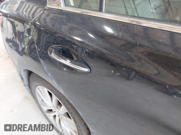 2015 Infiniti Q50 Premium z VIN JN1BV7AR9FM423471, wystawiony jako IAAI lot #42641857 z przebiegiem 86 919 mil mil oraz . Historia ofert i sprzedaży dostępna na DreamBid. Obrazek 17.