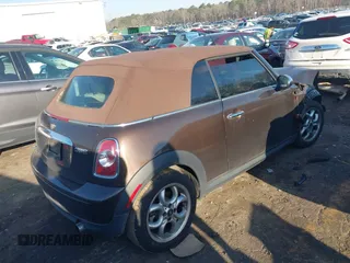 2011 MINI Convertible with VIN WMWZN3C55BT133367, listed as a IAAI auction lot 41781374 with 124,036 mi miles and . Bid and sale history available at DreamBid. Image 4.