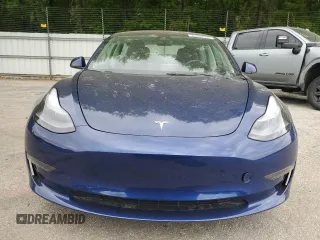 2023 Tesla Model 3 with VIN 5YJ3E1EA5PF695318, listed as a Copart auction lot 53832935 with 28,863 mi miles and Salvage title. Bid and sale history available at DreamBid. Image 5.