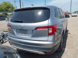 2020 Honda Pilot EX-L z VIN 5FNYF5H52LB007696, wystawiony jako IAAI lot #42065587 z przebiegiem 74 781 mil mil oraz . Historia ofert i sprzedaży dostępna na DreamBid. Obrazek 4.